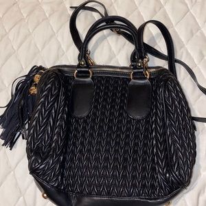 Black handbag with tassel detail
